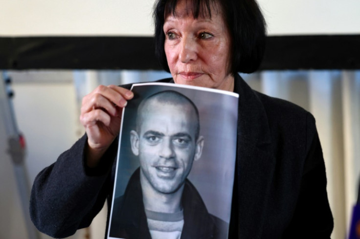'We didn't think it was possible to deport somebody from his birthplace,' said Denise Guidoux, pictured with a photo of her son Hamouri