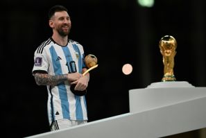 Argentina's captain Lionel Messi prepares to collect the World Cup trophy