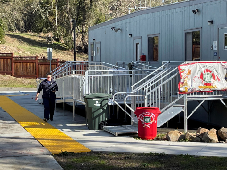A firefighter walks to her office functioning out of a temporary trailer in Santa Rosa