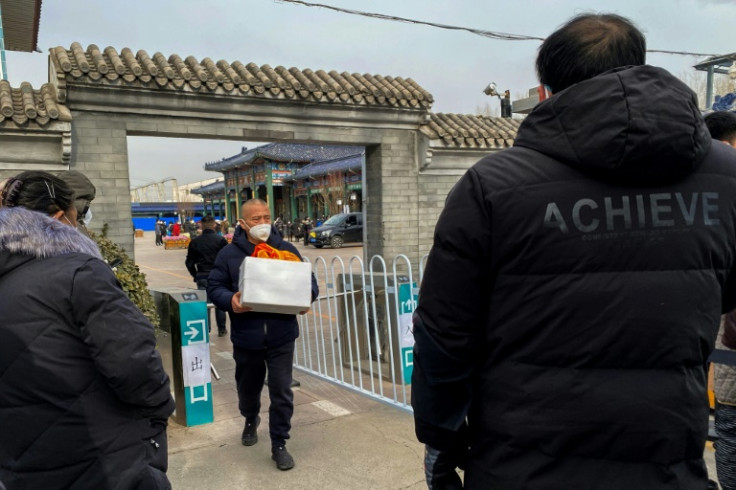 Workers at Beijing crematoriums say they are overwhelmed as China faces a surge in Covid cases that authorities warn could hit its underdeveloped rural hinterland during upcoming public holidays
