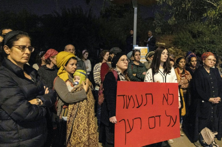 Orthodox Jewish women protest against prominent rabbi Zvi Tau outside the Israeli parliament or Knesset