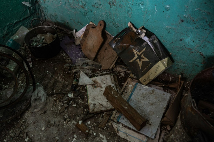 Russian soldiers visibly set up base in the school, leaving military rations, a filthy mattress and a uniform behind