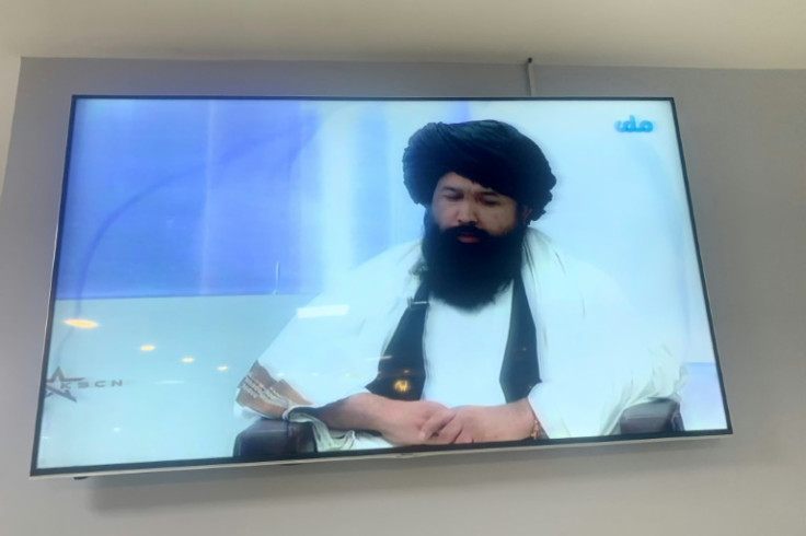 Neda Mohammad Nadeem, the minister of higher education for Afghanistan, speaks in a live television broadcast in Kabul as he explains the Taliban's decision to bar women from universities