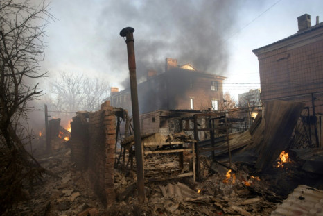 A building burns after shelling in Bakhmut, Donetsk region, the focus of the heaviest fighting in Ukraine in November and December