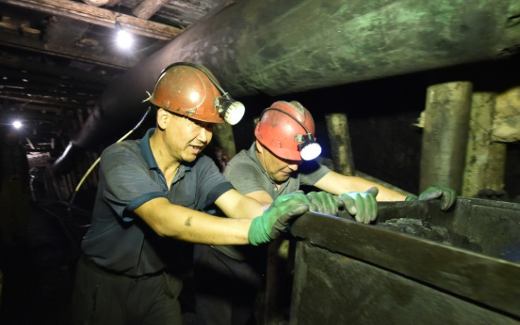 Miners working outside the town of Suluktu in ex-Soviet Kyrgyzstan are hopeful amid an uptick in global demand