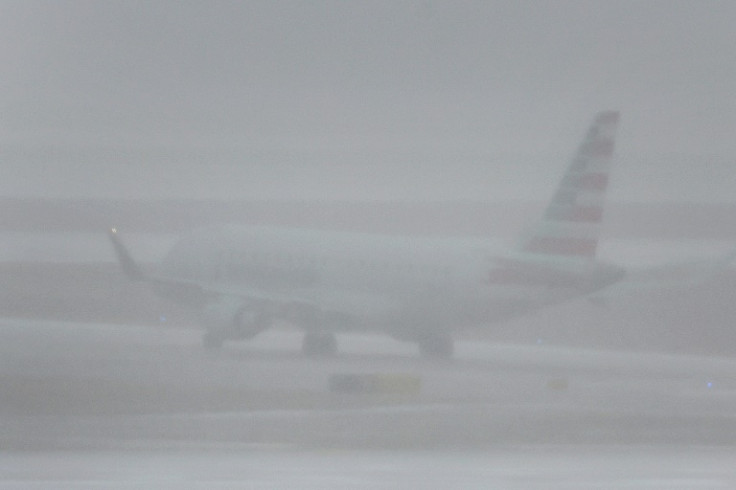 A jet takes off at O'Hare International Airport in Chicago, Illinois during a massive winter storm bringing snow, high winds, and sub-zero temperatures to much of the United States during one of the busiest travel periods of the year