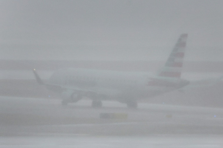 A jet takes off at O'Hare International Airport in Chicago, Illinois during a massive winter storm bringing snow, high winds, and sub-zero temperatures to much of the United States during one of the busiest travel periods of the year