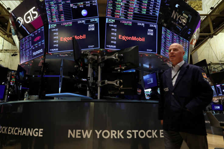 Traders work on the floor of the NYSE in New York