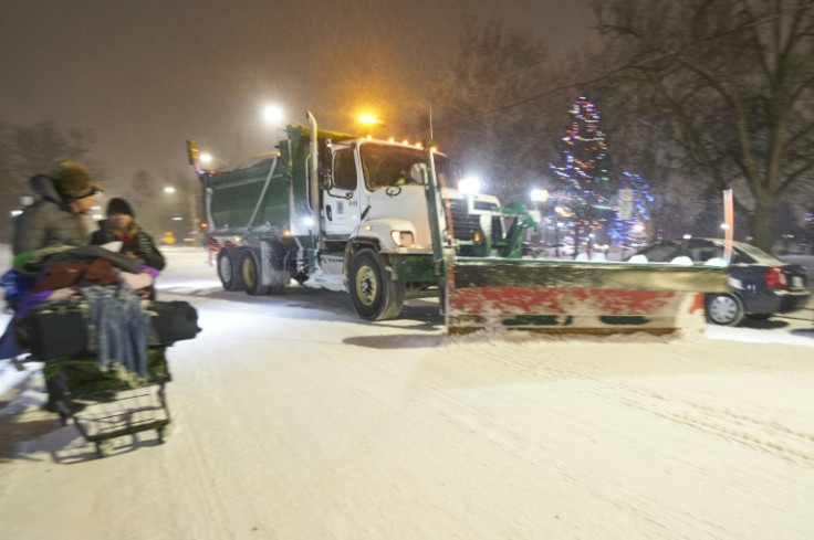 A snowplow clears a road on December 23, 2022, in London, Ontario in Canada during the severe winter storm that battered North America ahead of Christmas day