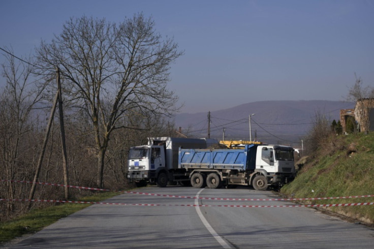 A road is barricaded with trucks by ethnic Serbs near the northern Kosovo town of Zvecan