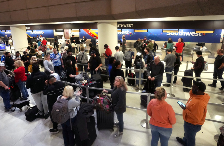 People wait in long lines for the Southwest Airlines check-in counters at Phoenix Sky Harbor International Airport