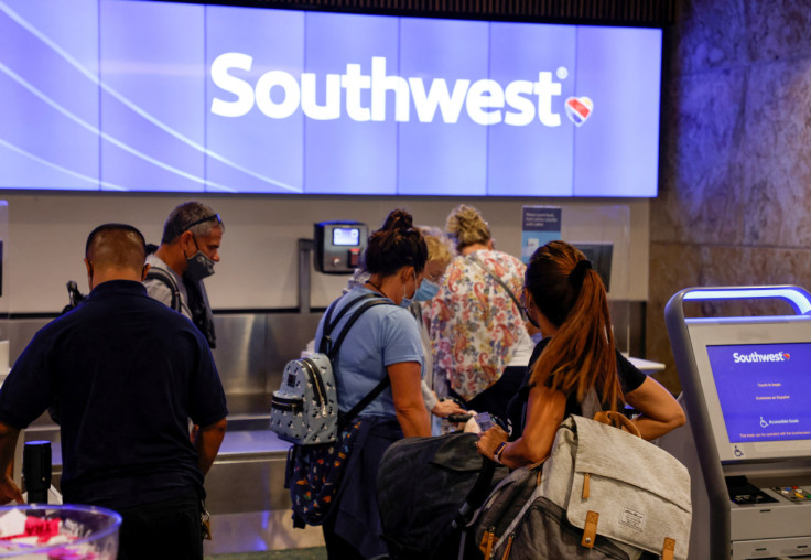 Passengers check in for a Southwest Airlines flight at Orlando International Airport in Orlando