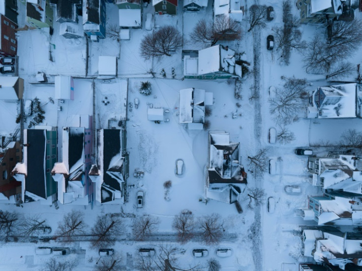 In this aerial photo, cars are still buried in the blizzard’s snow in Buffalo, New York, on December 28, 2022