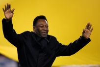 Former Brazil soccer player Pele greets the crowd before the international friendly soccer match between Sheffield FC and Inter Milan at Bramall Lane, Sheffield