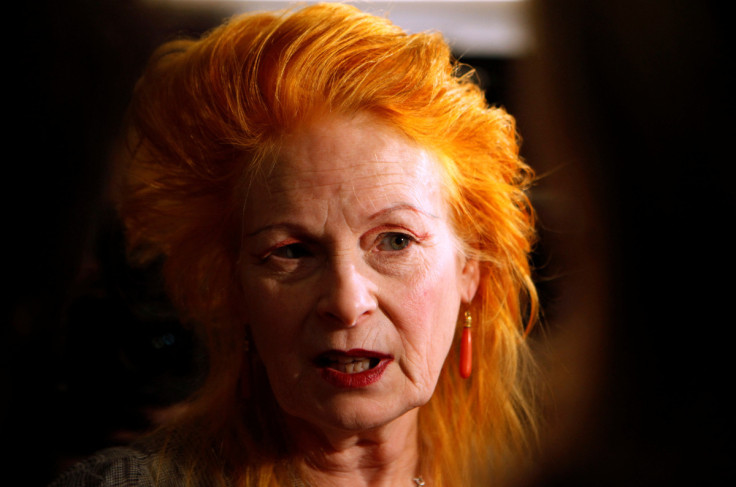 Fashion designer Vivienne Westwood talks to a journalist before the presentation of her 2011 Spring/Summer collection at the London Fashion Week
