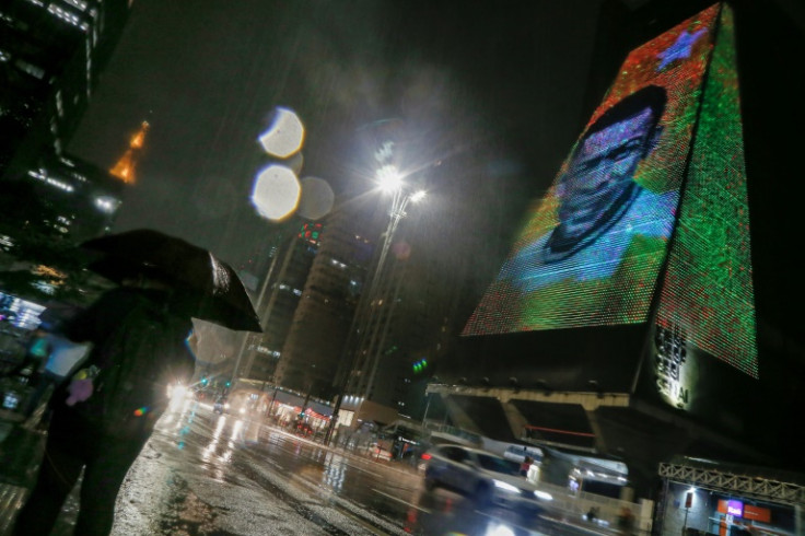 Brazilian football legend Pele is illuminated on the FIESP building in Sao Paulo following his death