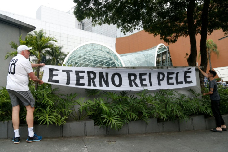 Outside Pele's hospital in the upscale Sao Paulo neighborhood of Morumbi, mourners hung a banner reading 'Eternal King Pele'