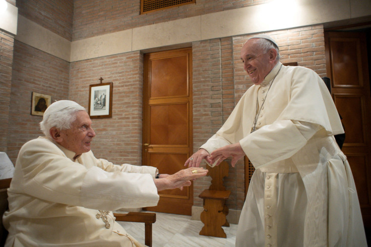 Pope Francis and Pope Emeritus Benedict XVI meet with new cardinals at the Vatican