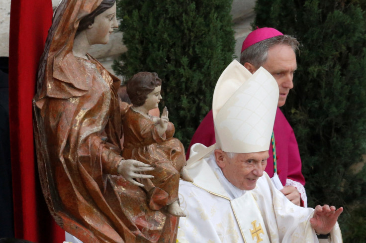 Former Pope Benedict XVI arrives to attend the canonisation ceremony of Popes John XXIII and John Paul II to start in St. Peter's Square at the Vatican