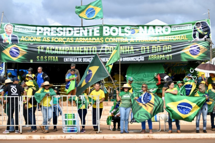 Supporters of Brazilian President Jair Bolsonaro hold a demonstration against the presidential election results that elected Luiz Inacio Lula da Silva as the new President in front of the Army headquarters in Brasilia, on December 29, 2022