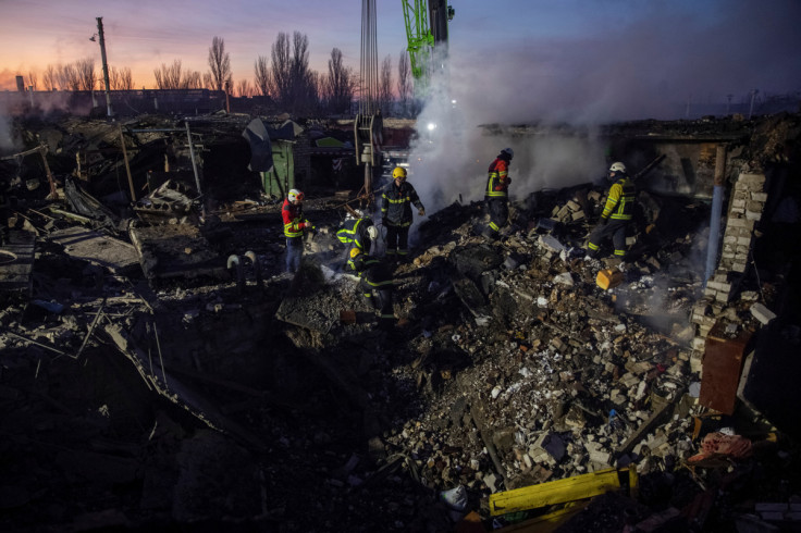 Rescuers work at an area heavily damaged by a Russian missile strike in Mykolaiv