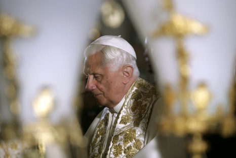 Former pope Benedict XVI, who has died at the age of 95, pictured on May 15, 2009, in front of the Stone of Anointing at the Church of the Holy Sepulchre in Jerusalem's Old City