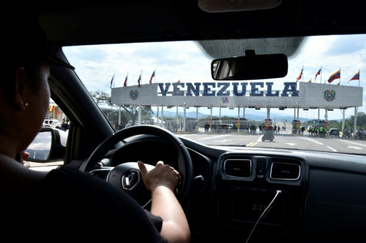 A woman drives her car towards the Venezuela-Colombia border crossing at the Atanasio Girardot International Bridge on January 1, 2023