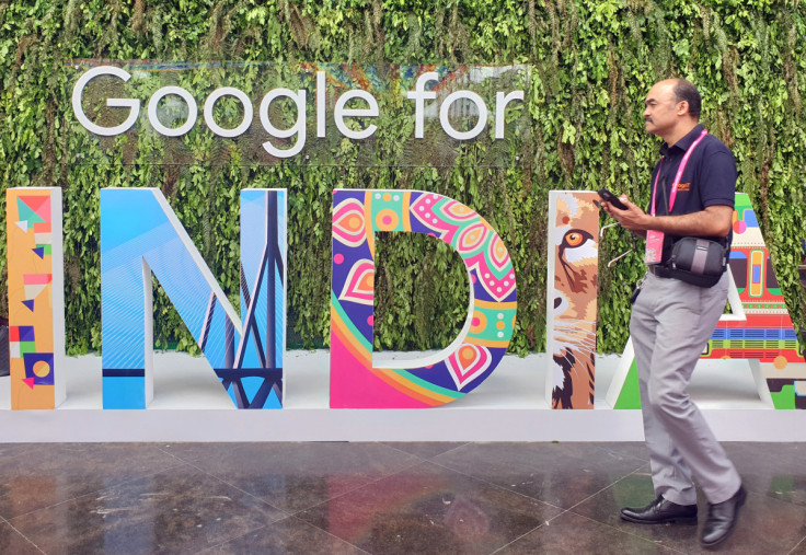 A man walks past the sign of "Google for India", the company's annual technology event in New Delhi