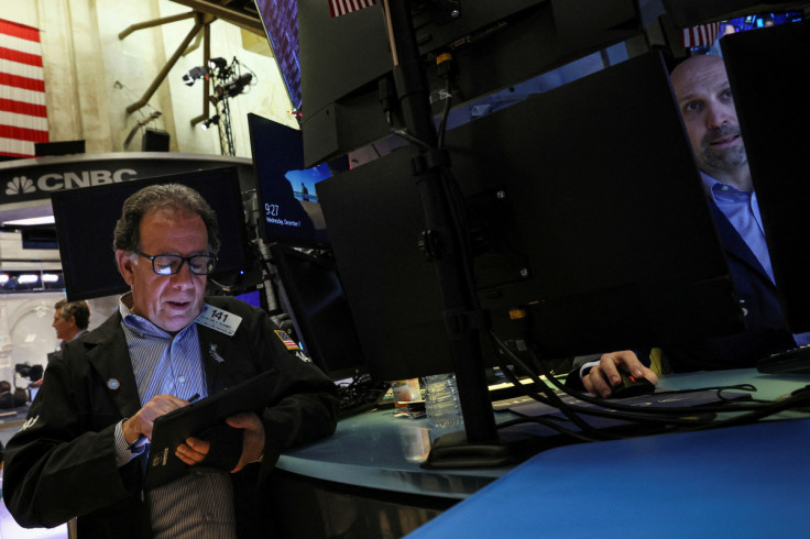 Traders work on the floor of the NYSE in New York