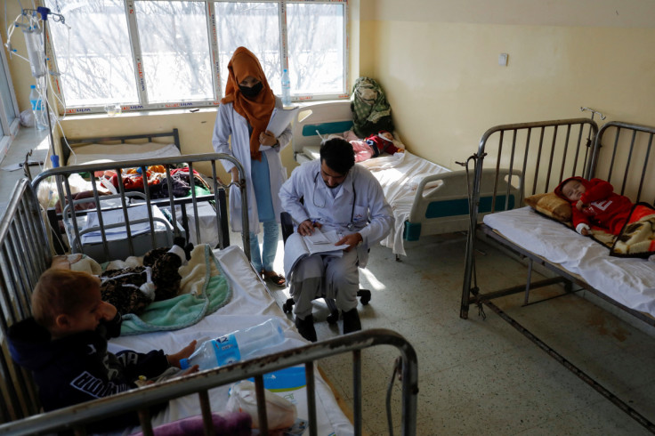 A doctor visits patients in a hospital following an increase in the number of pneumonia cases in Kabul