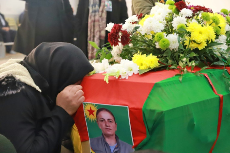 Iraqi Kurds attend the funeral of Emine Kara,  killed during a shooting attack in Paris last month, in the Kurdish city of Sulaimaniyah in northern Iraq