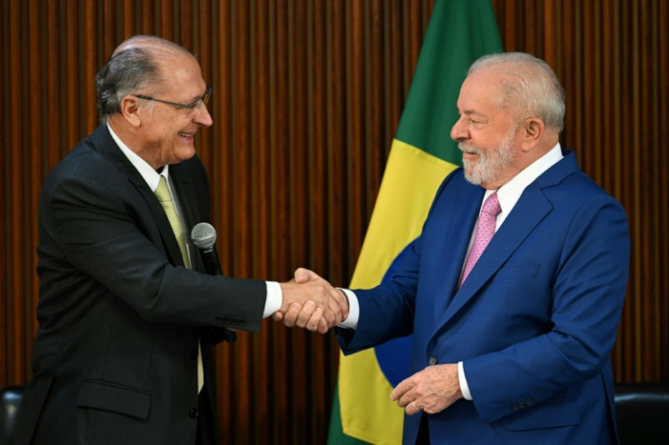 Brazil's President Luiz Inacio Lula da Silva shakes hands with his Vice President and Minister of Industry and Trade Geraldo Alckmin during his government's first cabinet meeting