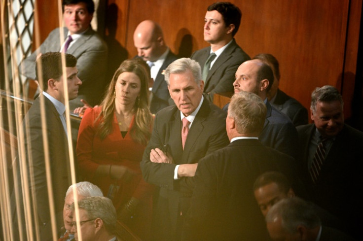 US House speaker hopeful  Kevin McCarthy (center) in conversation as voting continues at the US Capitol in Washington, DC, on January 5, 2023