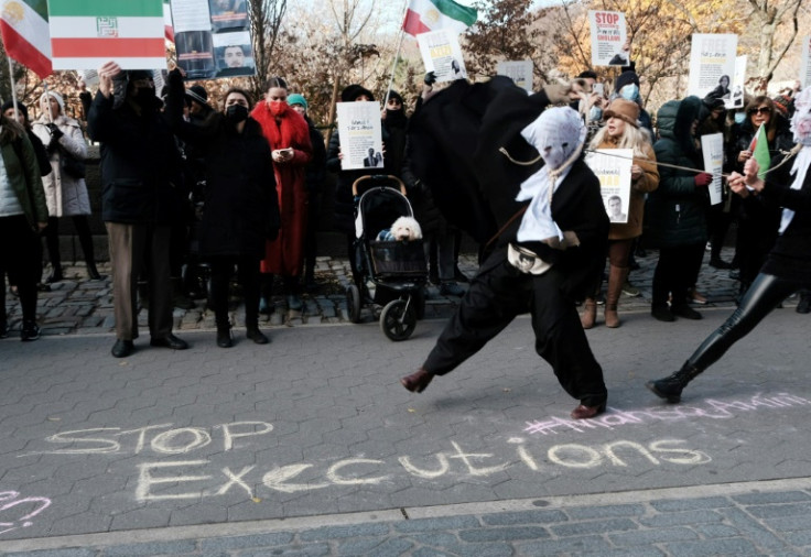 People demonstrate outside an Iranian diplomat's residence in New York after a protester's execution
