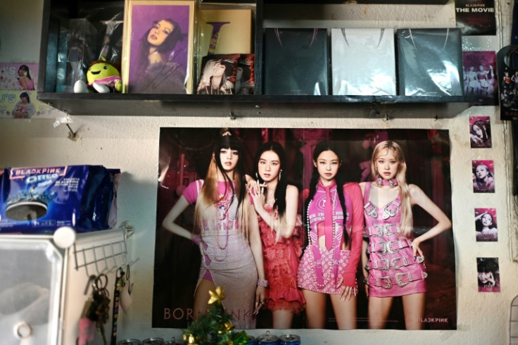 The 21-year-old university student's bedroom resembles a shrine to the girl group, with floor-to-ceiling posters