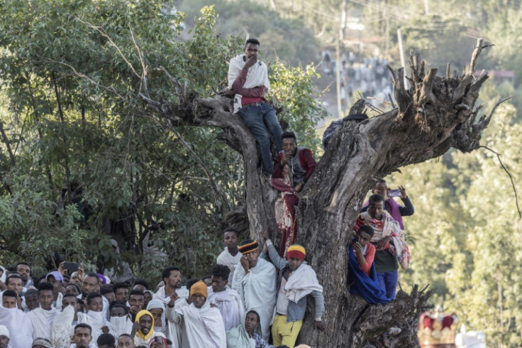 Pilgrims sit on trees in Lalibela as they  celebrate Genna, the Ethiopian Orthodox Christmas