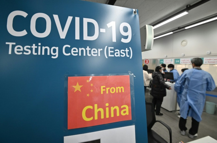 Around a dozen countries have slapped fresh travel regulations on travellers from China