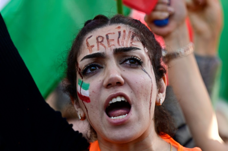 Protesters like this one in Germany, with the word 'Freedom' on her forehead, have influenced elements of the Iranian regime, an analyst said