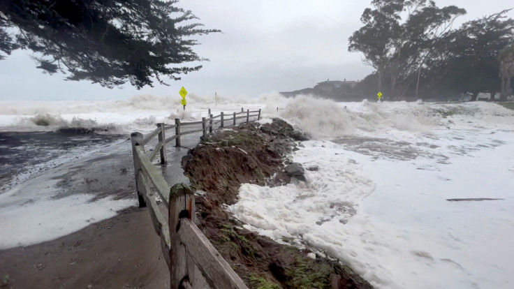 Waves brought by a massive Pacific storm rush ashore in Santa Cruz