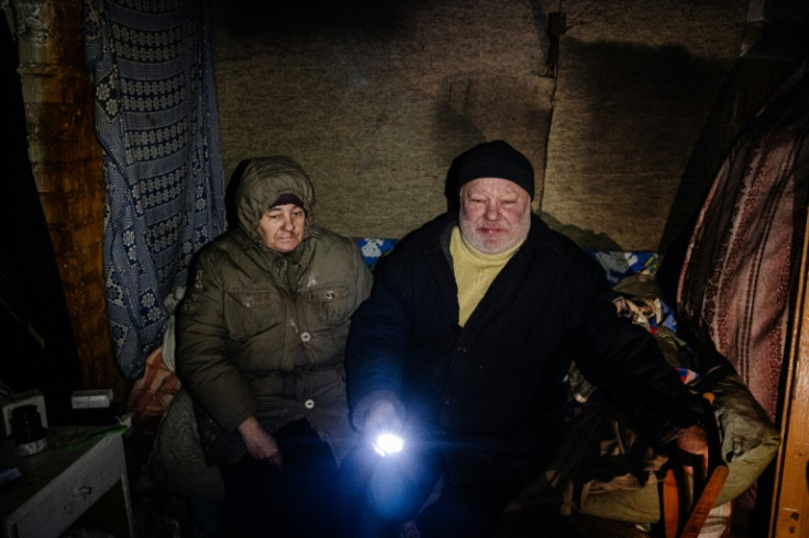 The Sirenkos chop firewood to relieve the stress of being together underground for months