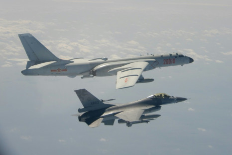 A Taiwanese F-16 fighter jet flying next to a Chinese H-6 bomber (top) in Taiwan's airspace