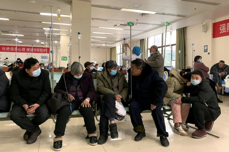Covid patients rest in a hallway at Fengyang People's Hospital in Fengyang County in east China's Anhui Province