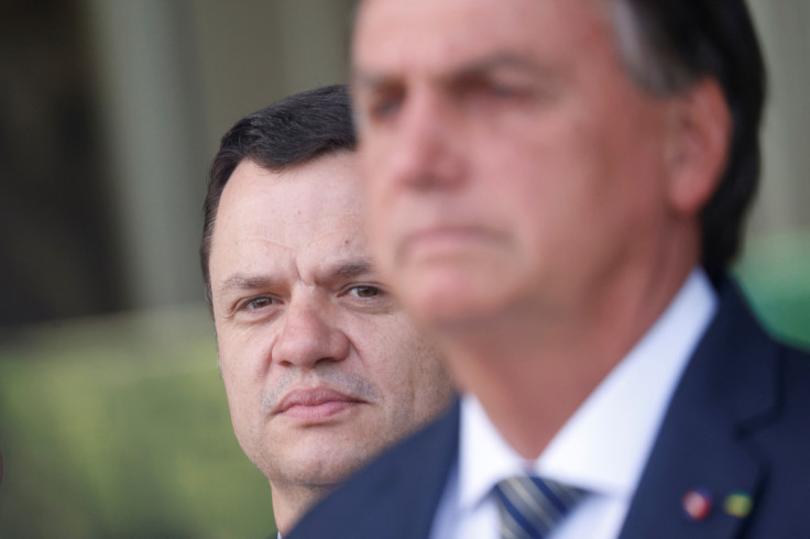 Brazil's Minister of Justice Anderson Torres looks on next to Brazil's President and candidate for re-election Jair Bolsonaro during a news conference at the Alvorada Palace in Brasilia