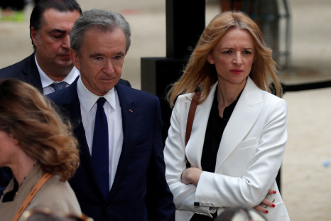 Bernard Arnault, CEO of LVMH Moet Hennessy Louis Vuitton SE, and Delphine Arnault, Executive Vice President of Louis Vuitton, leave after the Spring/Summer 2020 collection show for fashion house Louis Vuitton during Men's Fashion Week in Paris