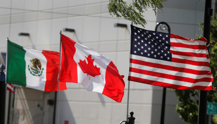 Flags of the U.S., Canada and Mexico fly next to each other in Detroit, Michigan