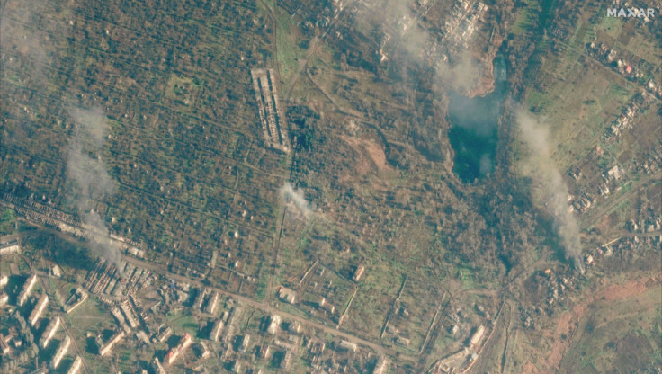A satellite view shows a smoldering building, in Soledar