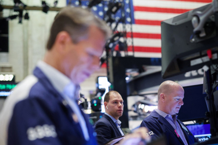 Traders work on the trading floor at the New York Stock Exchange (NYSE) in New York City