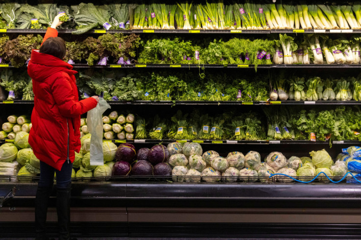 A person shops for vegetables at a supermarket in Manhattan, New York City