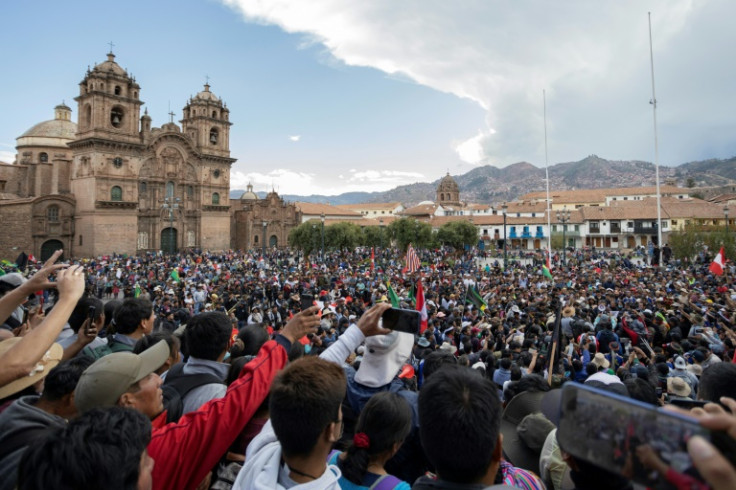 People take part in a demonstration and ceremony to pay a final tribute to Remo Candia, the leader of the Anta peasant community, at Cusco's main square in Peru, on January 12, 2023