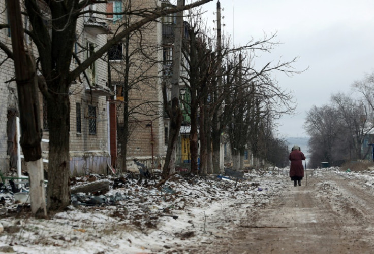 Even as the fighting grinds on mere kilometres away, local officials and volunteers try to maintain basic services